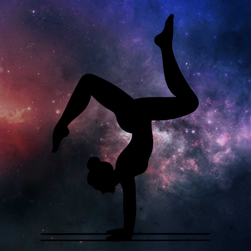 a woman doing a handstand