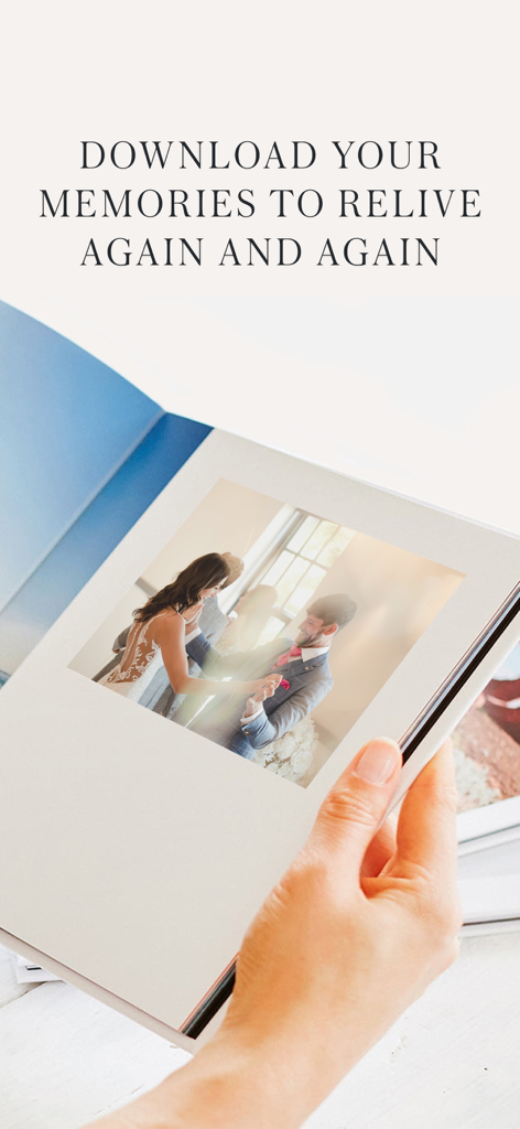 Wedding Photo Swap & Share - A person holding a photo book showing a bride and groom dancing during their wedding