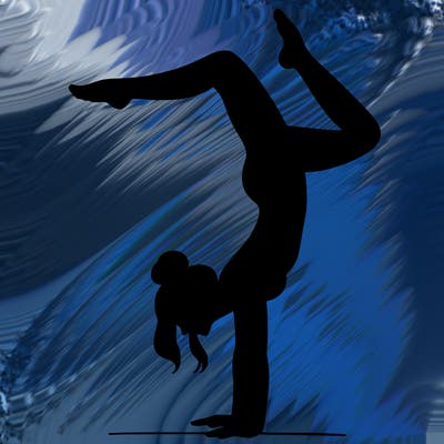 a woman doing a handstand