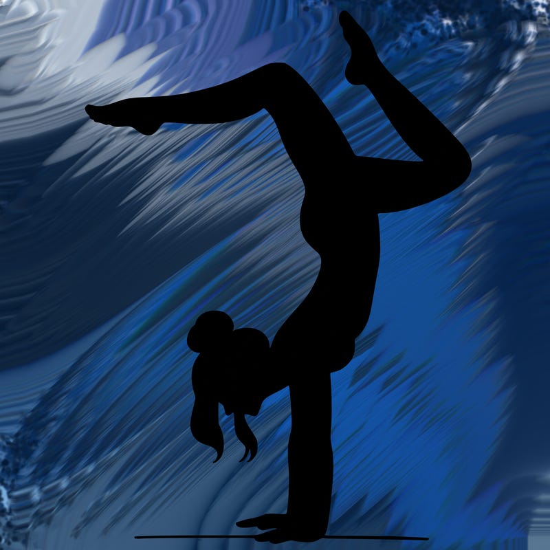 a woman doing a handstand