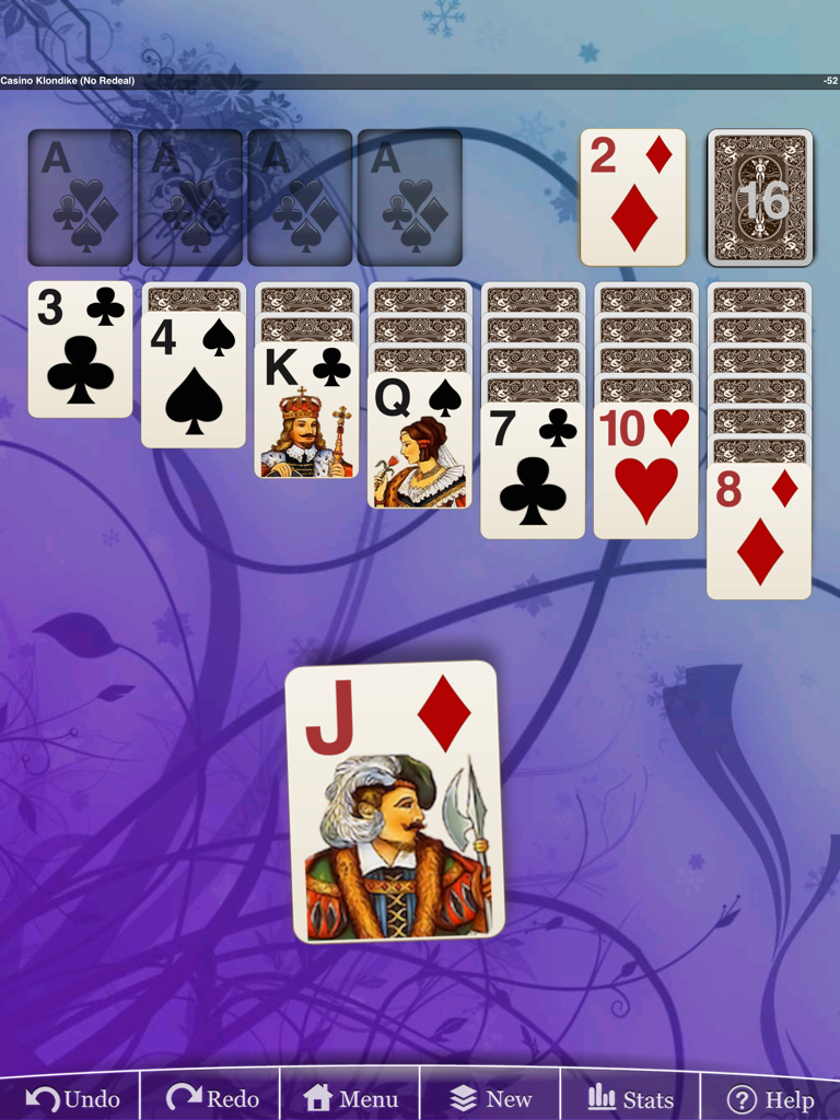 Jugabilidad de Erics Klondike Solitaire en un iPad con un fondo floral morado.