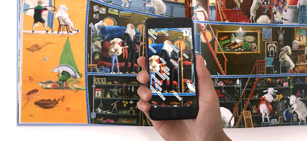 alfabet - A person using the Alfabet app on a smartphone to show word labels over an illustrated book page.