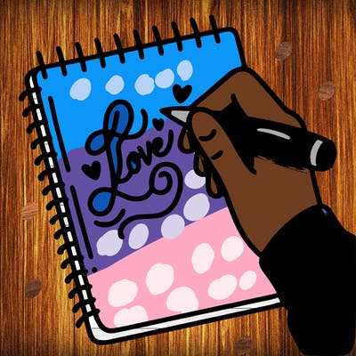 a hand writing “love” in calligraphy on a notebook