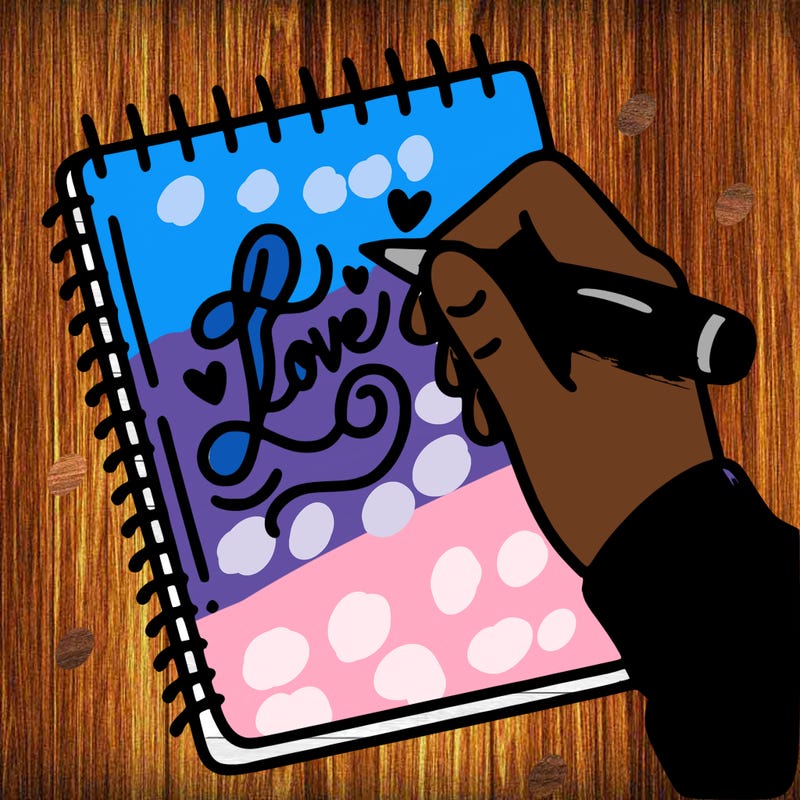 a hand writing “love” in calligraphy on a notebook