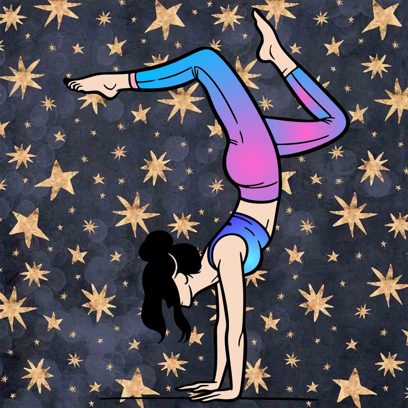 a woman doing a handstand