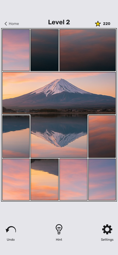 Jigsaw by Staple Games - Minimalist jigsaw puzzle game showing a mountain landscape during sunset