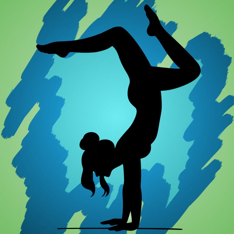 a woman doing a handstand