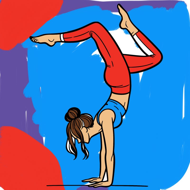 a woman doing a handstand