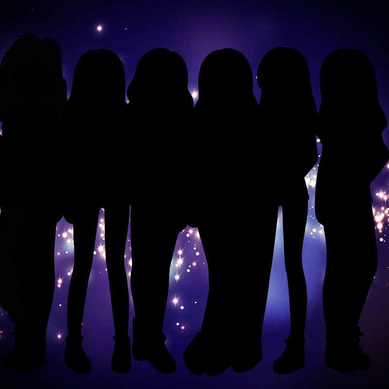 a group of girls wearing crop tops and shorts