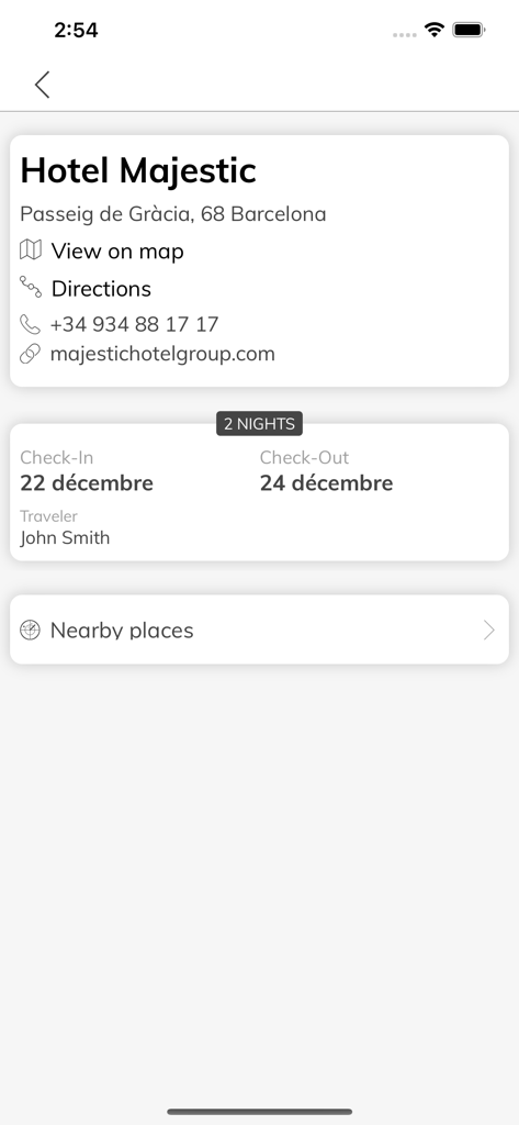 Mon Carnet de Voyage - Détails de la réservation d'hôtel numérique montrant les dates de réservation et les informations de contact pour un séjour à Barcelone