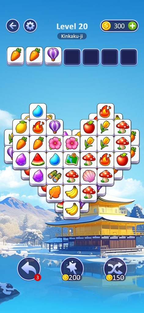 Tile Vacation - Triple Match - Jugabilidad de Tile Vacation con un puzle en forma de corazón y un escenario de un templo japonés nevado.