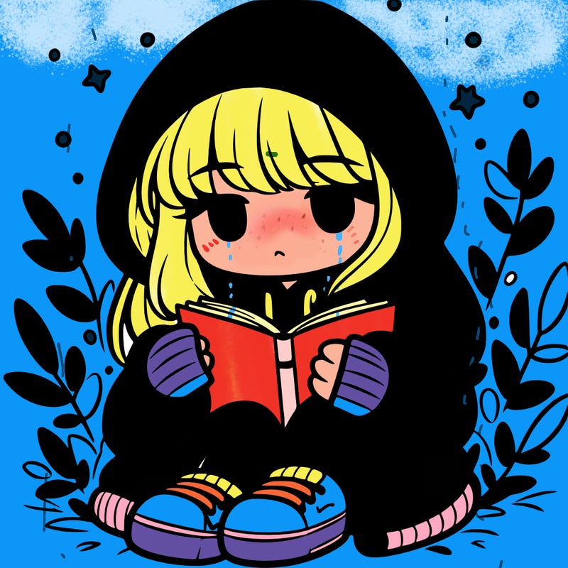 girl in oversized hoodie reading a book