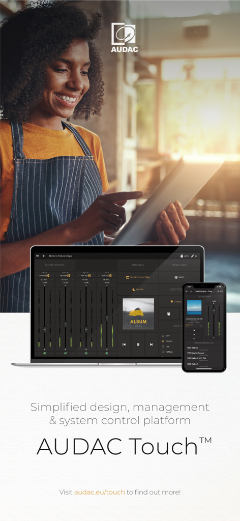 A professional venue manager using the AUDAC Touch 2 app on a tablet to control audio systems across multiple zones and devices