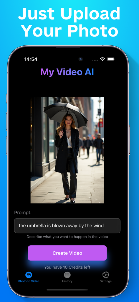 My Video AI - Image To Video - Screenshot of the My Video AI app interface showing a photo of a woman with an umbrella and a text prompt to animate the scene