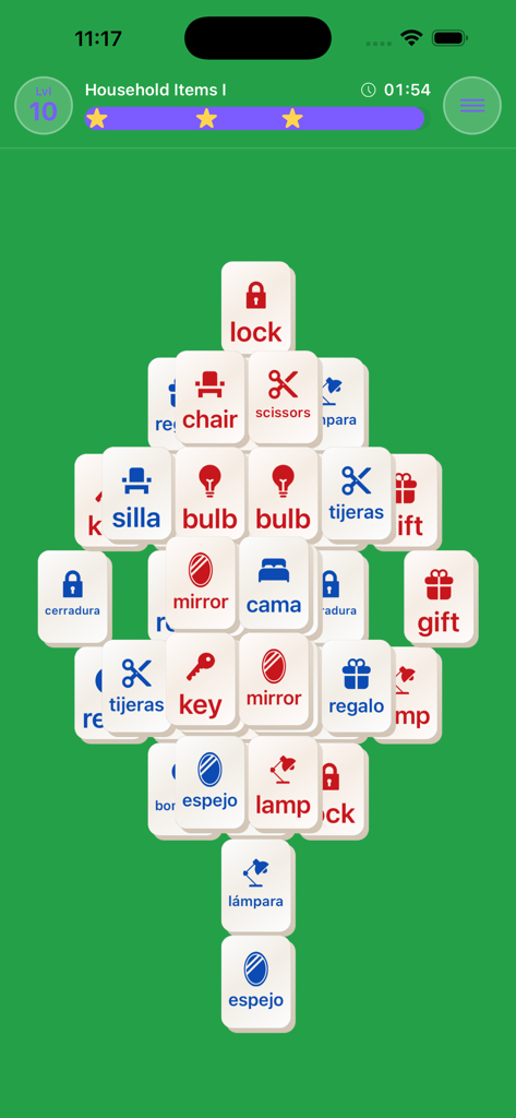 Mahjong Lingo - A Mahjong Lingo game level showing tiles with icons and words in English and Spanish such as mirror, lamp, and scissors.