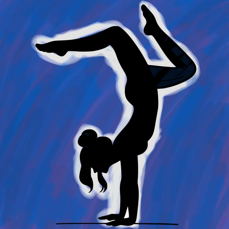 a woman doing a handstand