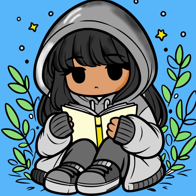 girl in oversized hoodie reading a book