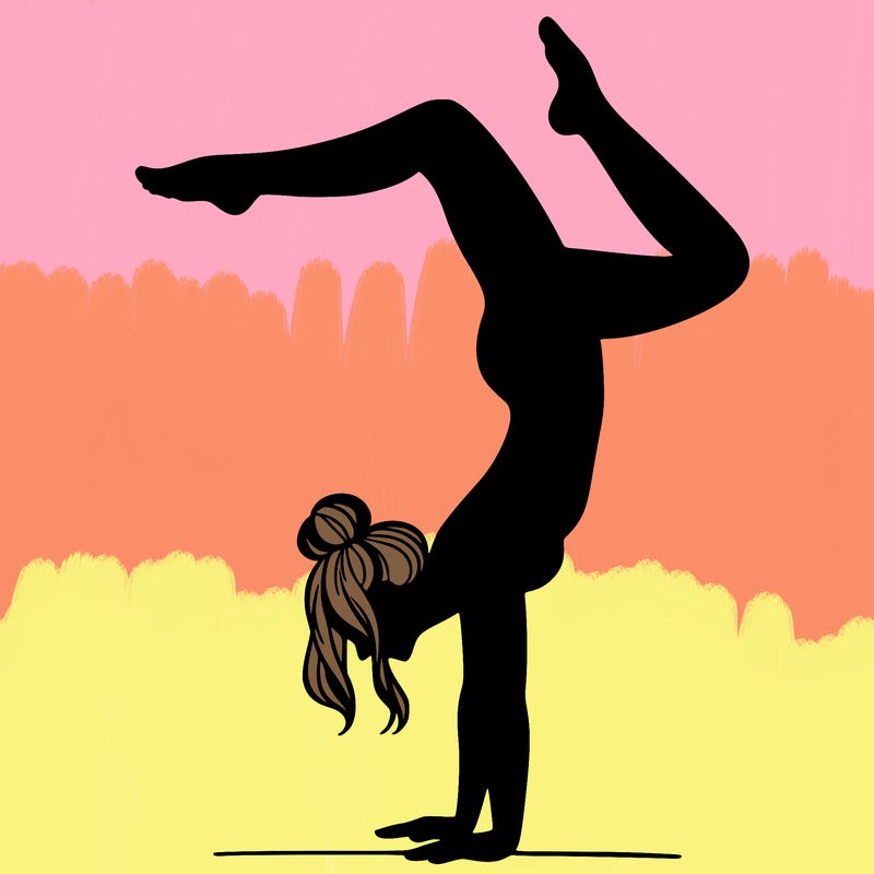 a woman doing a handstand