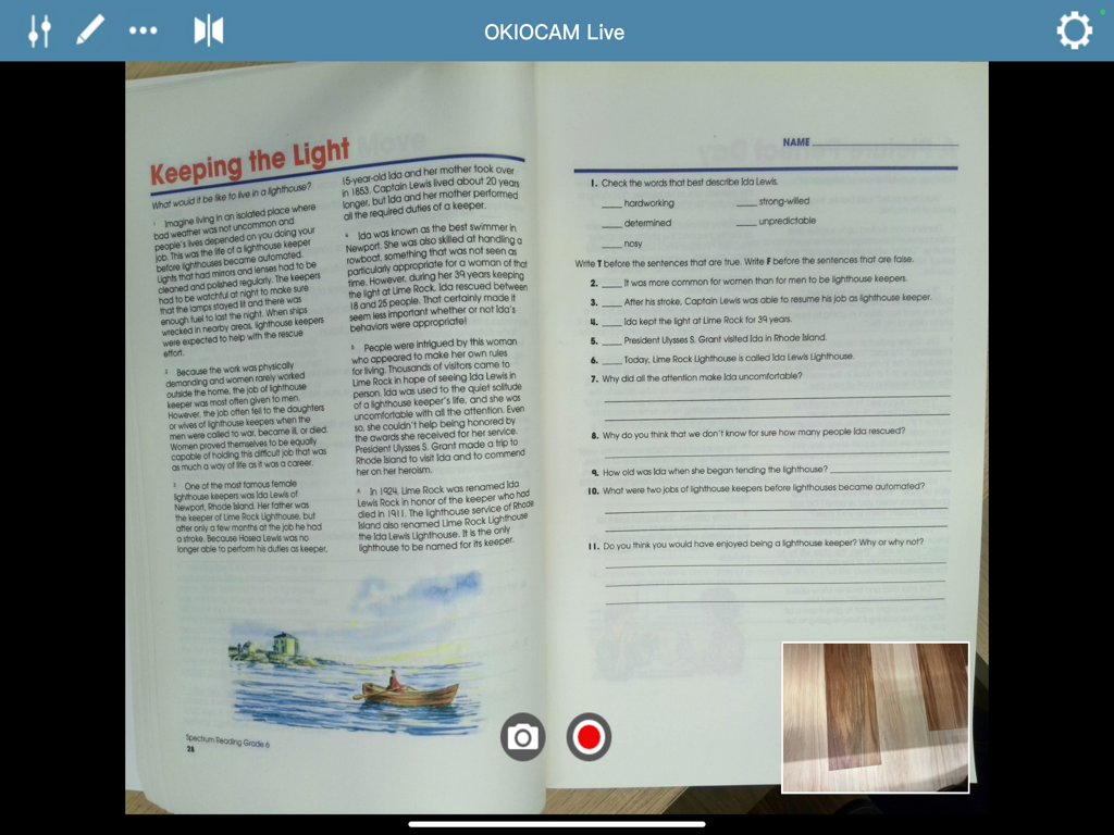 OKIOCAM Live app interface on iPad showing a live feed of a physical workbook and a picture in picture window.