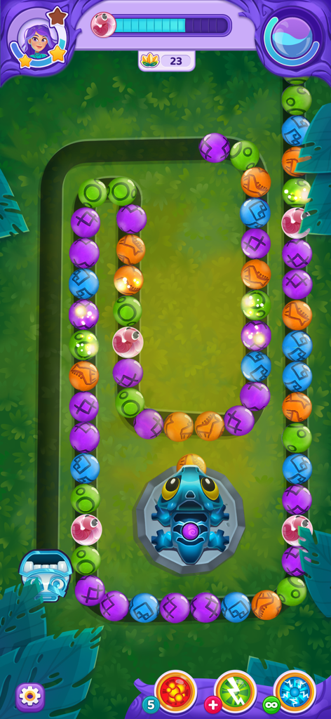 Un colorido nivel de disparos de canicas en Viola's Quest con canicas en un sinuoso camino forestal