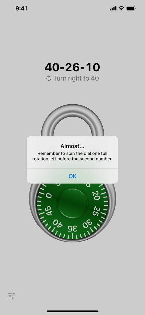 A green combination lock with a helpful hint message in the Practice Lock app.