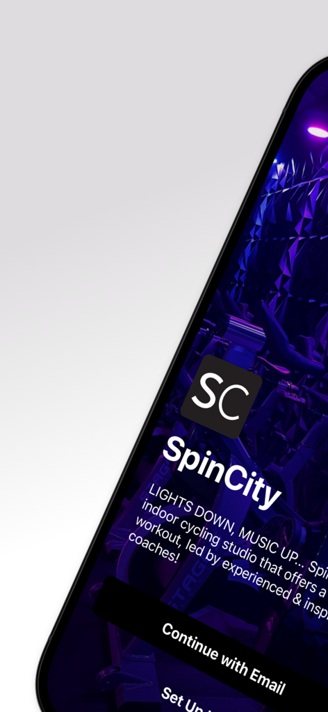SpinCity 11762 - SpinCity 11762 fitness app welcome screen featuring a dark indoor cycling studio with neon lighting