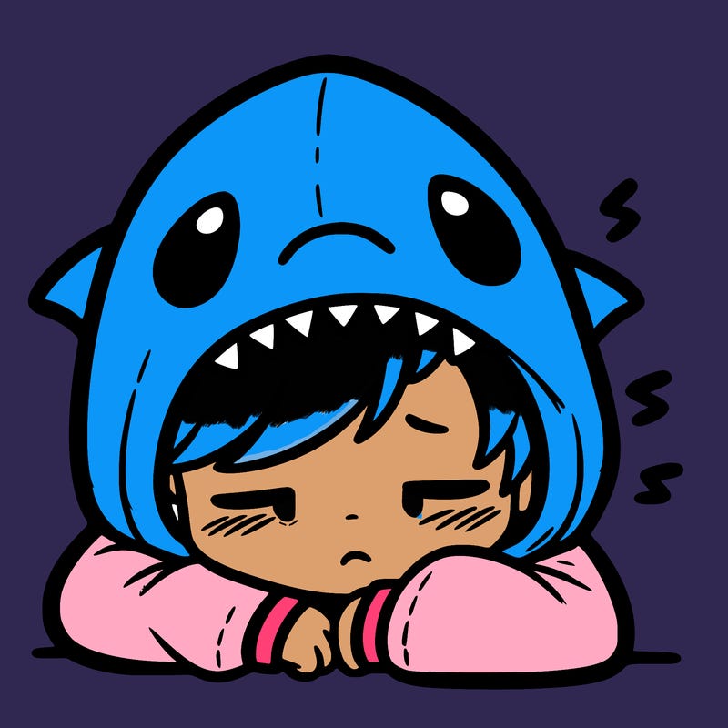 tired boy in shark hoodie