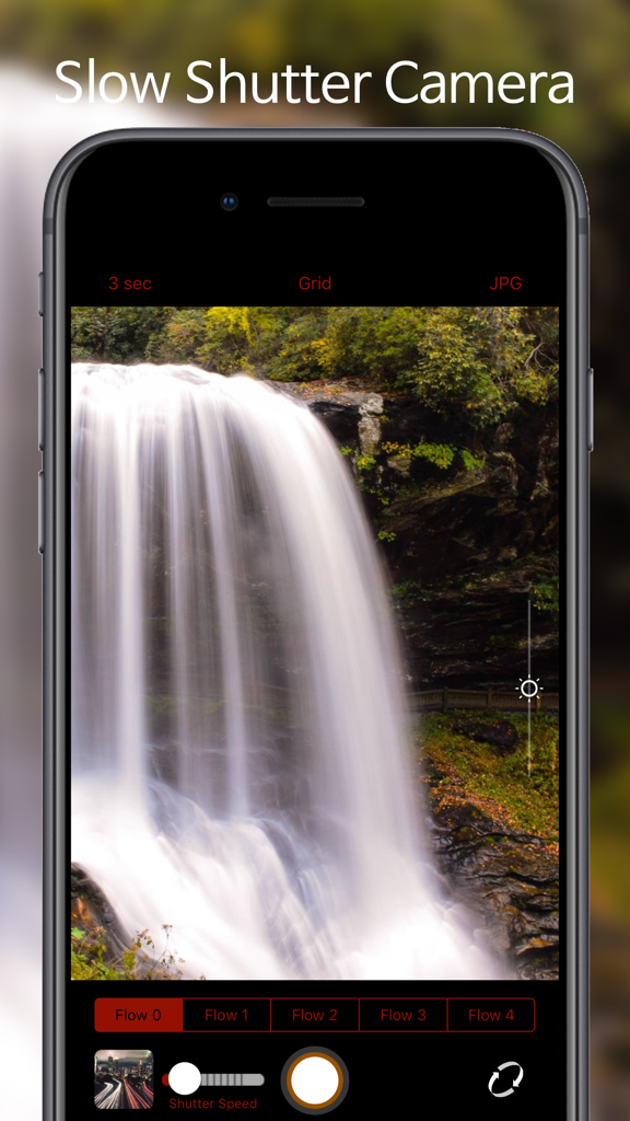 A smartphone screen displaying the Flow Shutter Cam app interface while capturing a long exposure photo of a waterfall with a silky water effect.