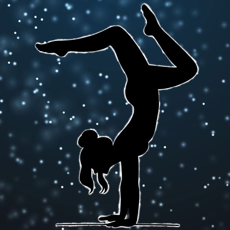 a woman doing a handstand