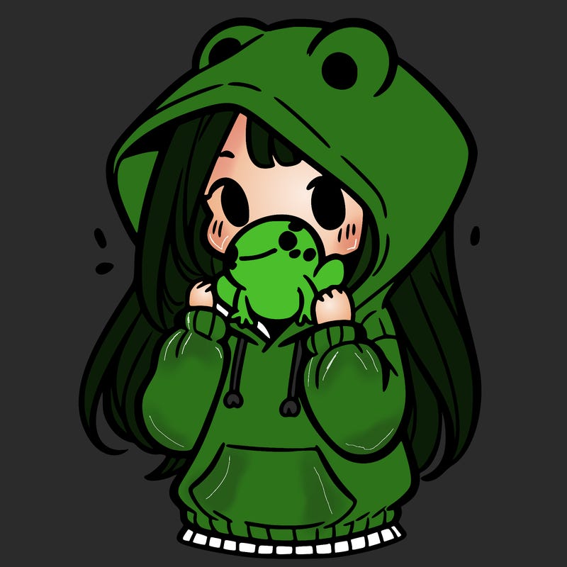a girl holding a froggy hoodie