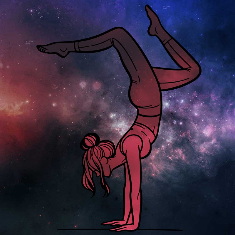 a woman doing a handstand