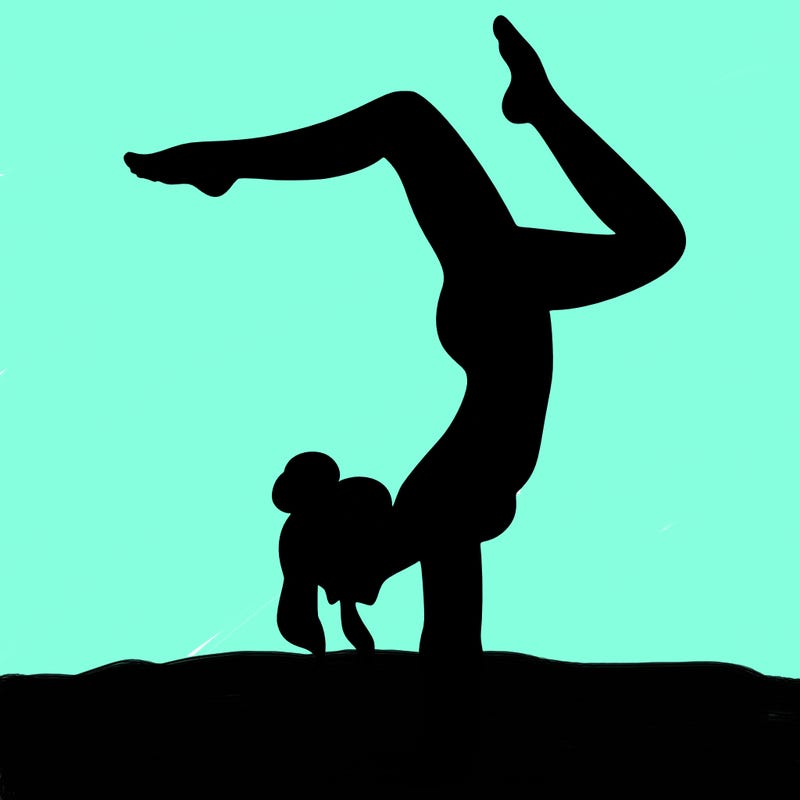a woman doing a handstand