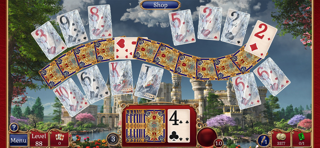 Jewel Match Solitaire - Pantalla de jugabilidad de Jewel Match Solitaire mostrando cartas congeladas sobre un paisaje de castillo medieval.