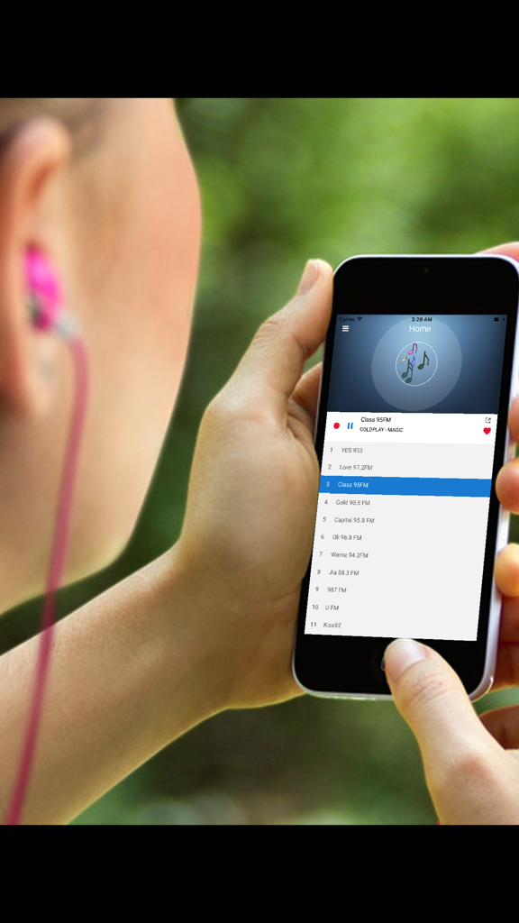 Japan Radio Station - JP FM - A person holding an iPhone displaying the Japan Radio Station app interface while wearing earbuds