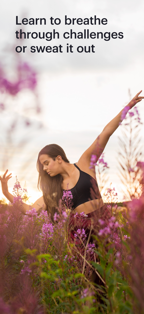 A woman practicing yoga and mindfulness in a field of purple flowers at sunset