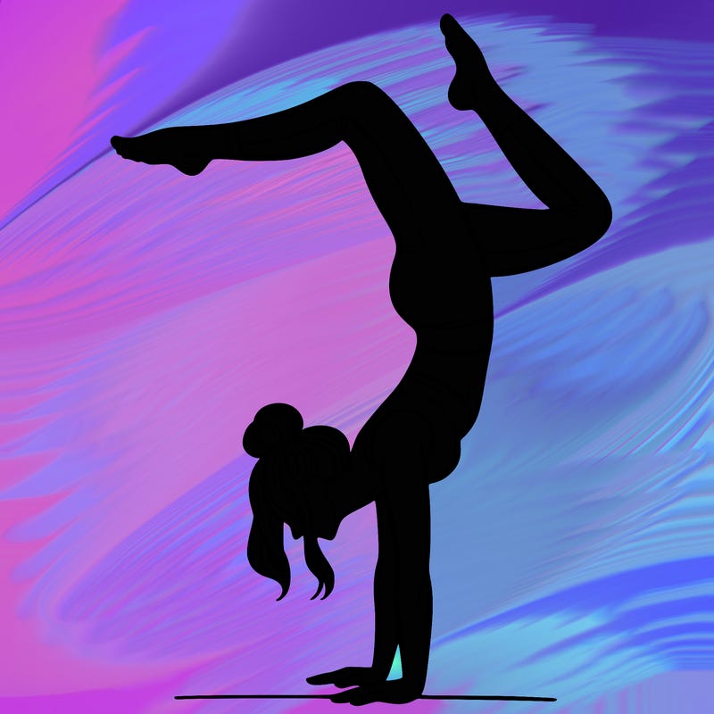 a woman doing a handstand