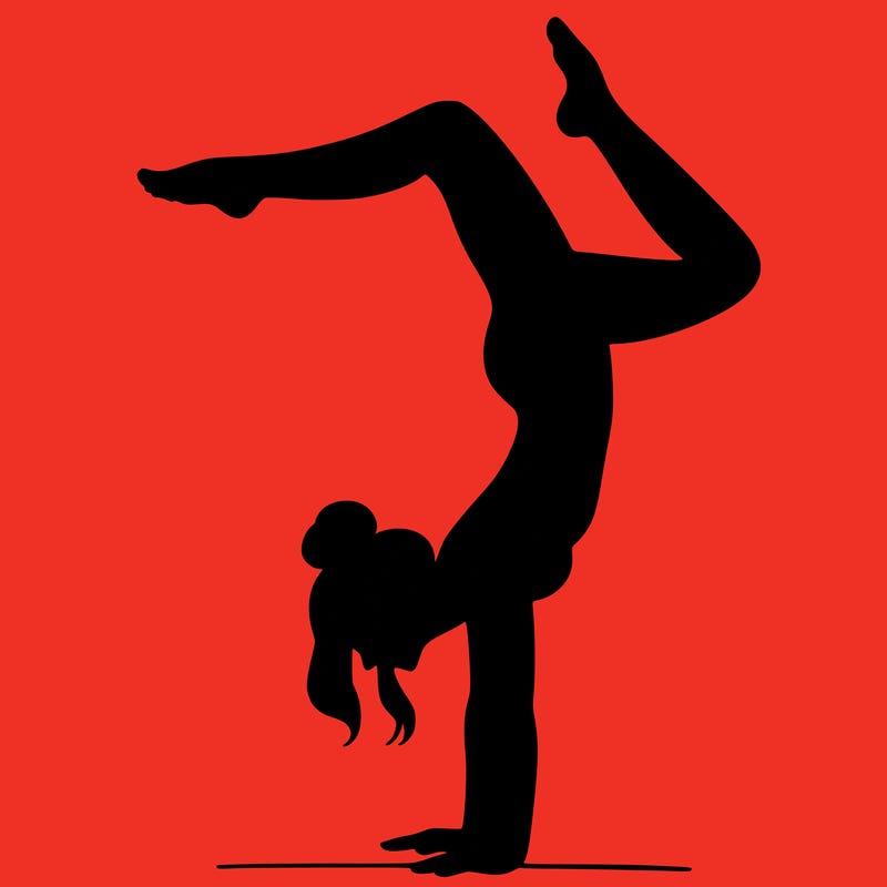 a woman doing a handstand