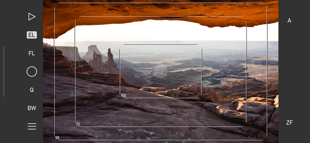 Mark II Artist's Viewfinder - Mark II Artist's Viewfinder app interface showing technical frame lines and focal length simulations over a desert canyon landscape.