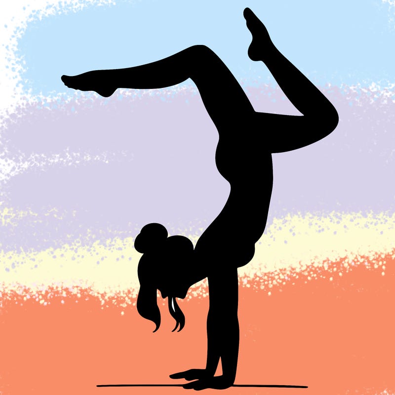 a woman doing a handstand