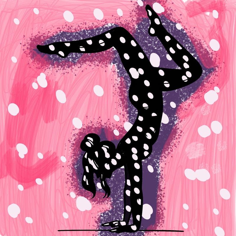 a woman doing a handstand