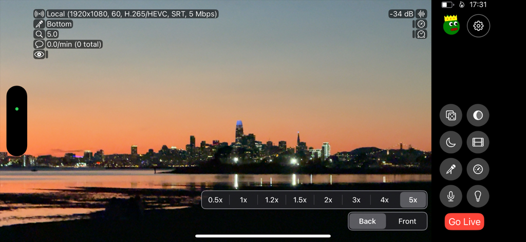 Moblin - Moblin app professional live streaming interface with technical stats overlaying a city skyline at sunset