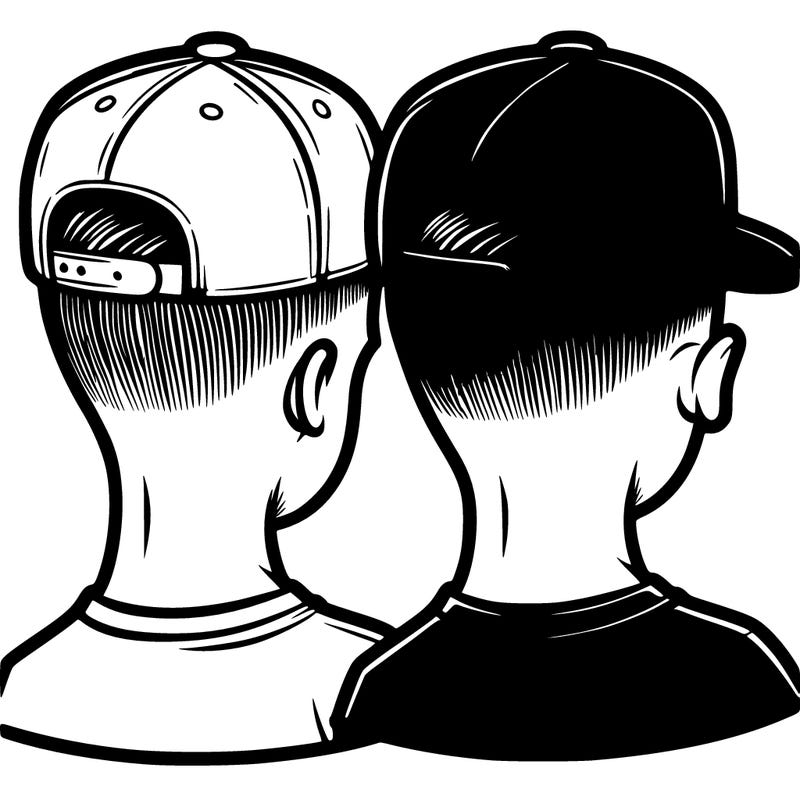 low taper fade with a backwards hat and a blue shirt