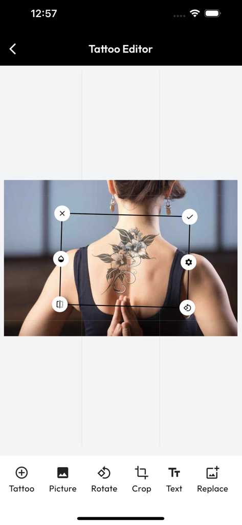 InkHunter Pro - InkHunter Pro app tattoo editor interface showing a floral design preview on a womans back