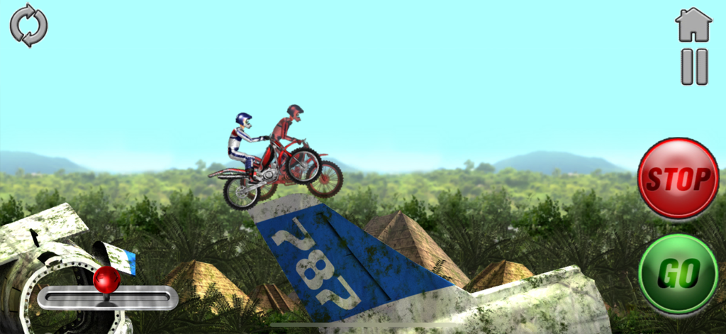 A motocross rider racing a ghost opponent over airplane wreckage in a jungle environment with pyramids