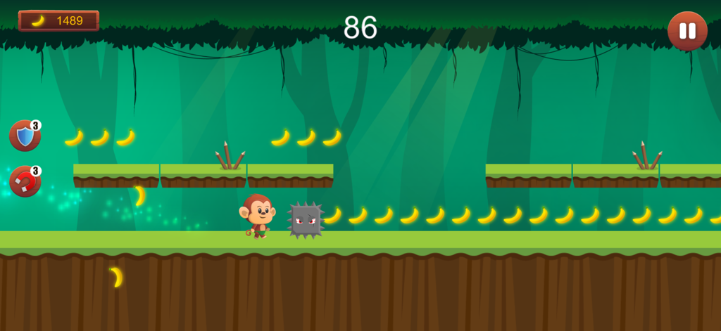 A cartoon monkey jumps over a spiked obstacle to collect bananas in a jungle platformer game