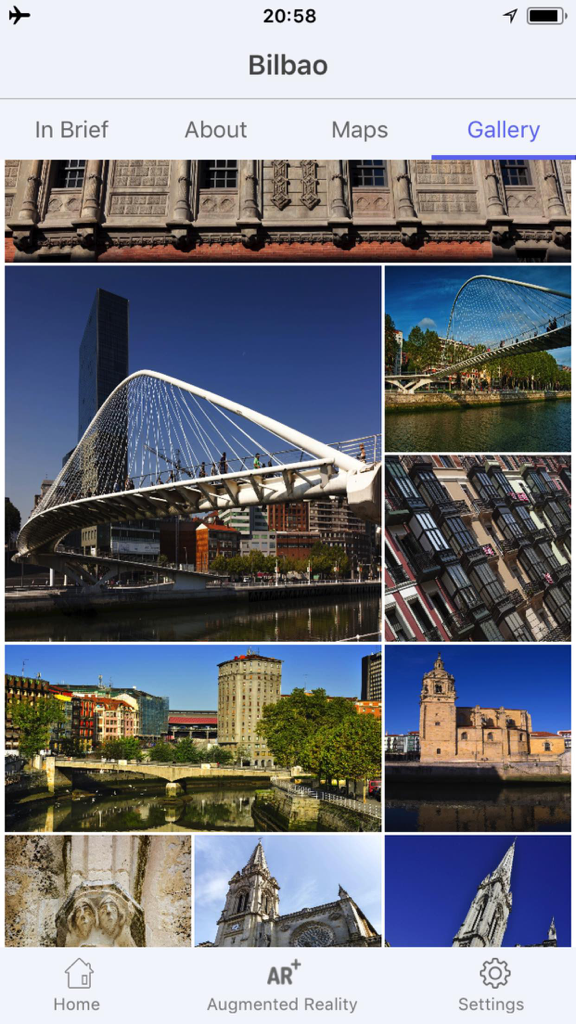 Bilbao Travel Guide Offline - Pantalla de galería de la aplicación Guía de Viaje de Bilbao con fotos de lugares emblemáticos de la ciudad como el puente Zubizuri y arquitectura histórica.