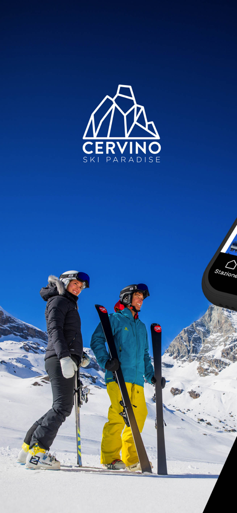 Due sciatori in tenuta completa in piedi su un pendio innevato sotto un cielo azzurro limpido con il logo Cervino Ski Paradise