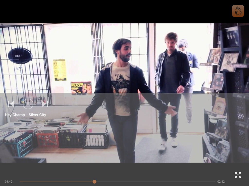 BUBUKA for iPad - Interface of the BUBUKA app for iPad showing a music video playback with player controls for commercial background entertainment.
