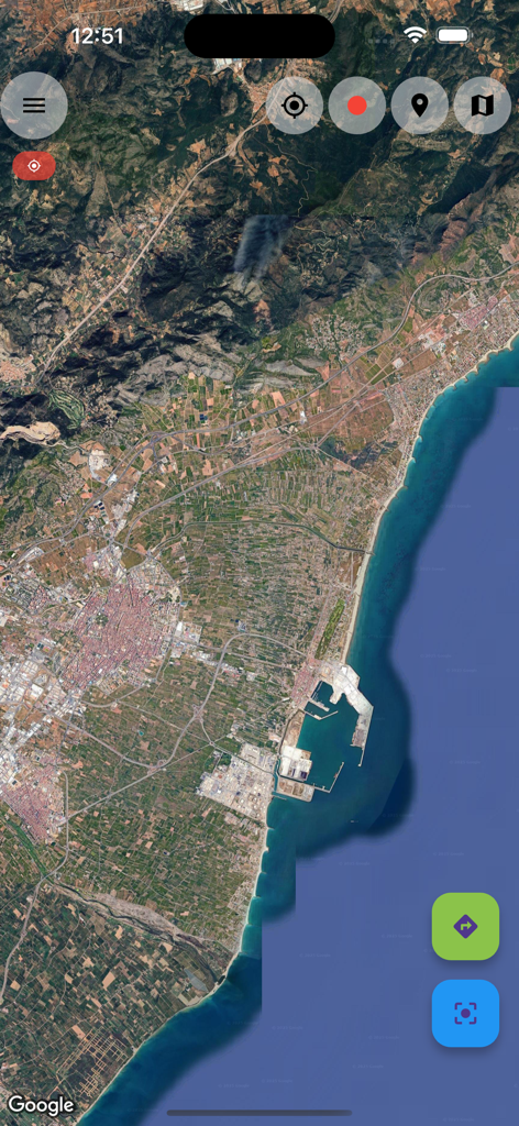 OruxMaps - Satellite map view in the OruxMaps app showing a coastal region and mountains