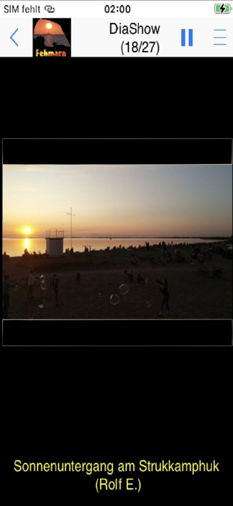 Fehmarn App slideshow showing a sunset at Strukkamphuk beach